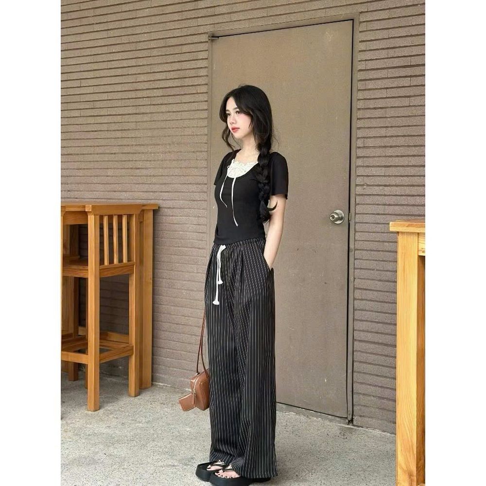 Quần ống rộng có lưng thun dây luồng mặc thoải mái cho cả nam và nữ