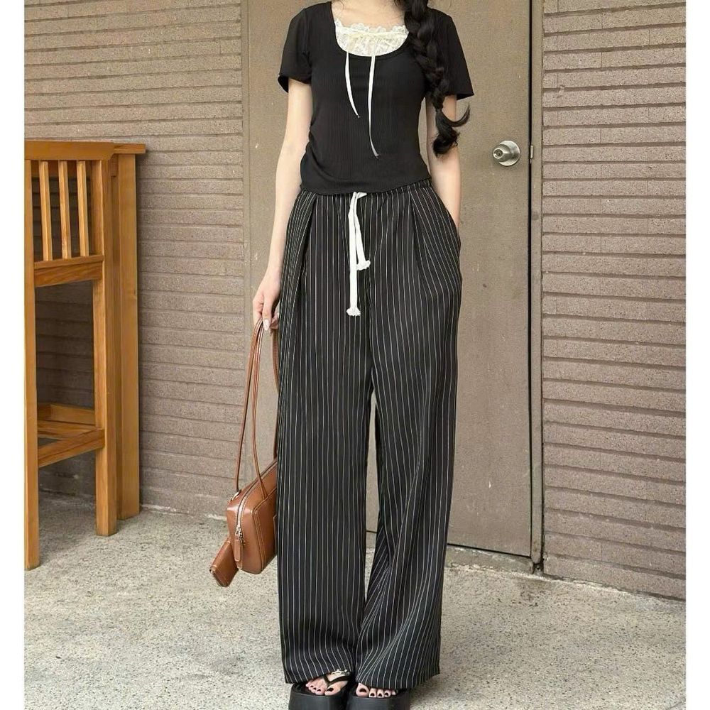 Quần ống rộng có lưng thun dây luồng mặc thoải mái cho cả nam và nữ