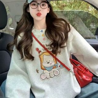 Áo dài tay nữ cổ tròn đính charm nút Áo dài tay nữ cổ tròn đính charm nút