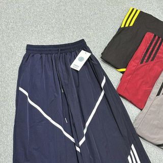 Quần Ống Rộng Dây Rút Chất Dù Nhăn Phối Viền V Và Sọc Freesize Dưới 65kg